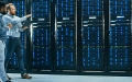 Technician and engineer walking in data center