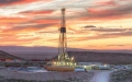 drilling rig at sunset