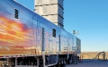 Trailer containing mobile, gas turbine-driven power generators.