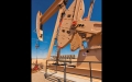 pump jack with tanks in background