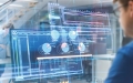 man looking at abstract computer screen