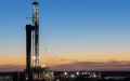 Permian drilling rig at sunset