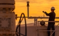 man on pipeline at sunset