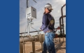 man looking at field equipment