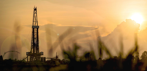 drilling rig with shadow of grass peak