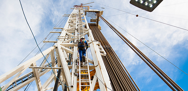 worker climbing a rig