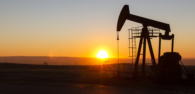 pumpjack with sunset in the background