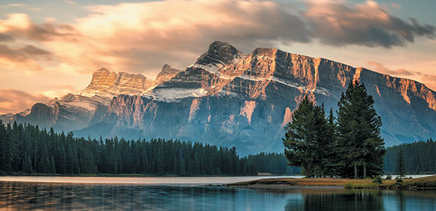 mountain with sun and lake