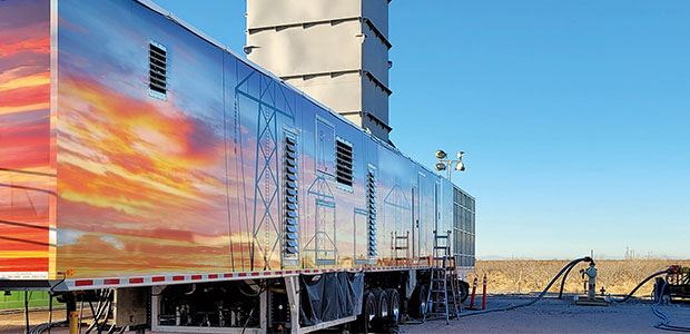Trailer containing mobile, gas turbine-driven power generators.