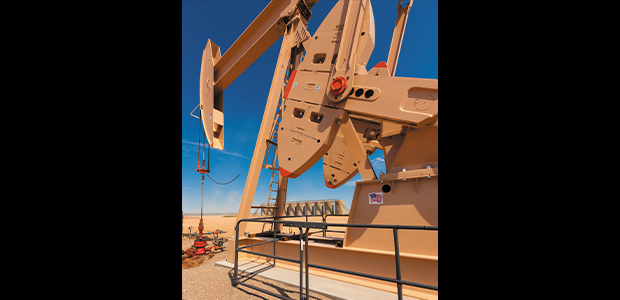 pump jack with tanks in background