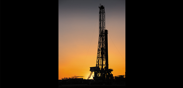 drilling rig at sunset