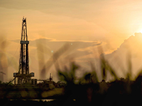 drilling rig with grass peaks