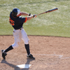 Baseball player hitting ball