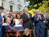 trump signing the bill