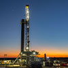Eagle Ford drilling rig at sunset