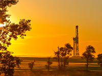 rig with sun setting
