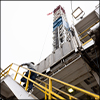 man climbing steps to drilling rig