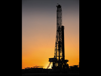 drilling rig at sunset