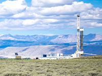 rig with mountains in the background