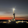 drilling rig at sunset